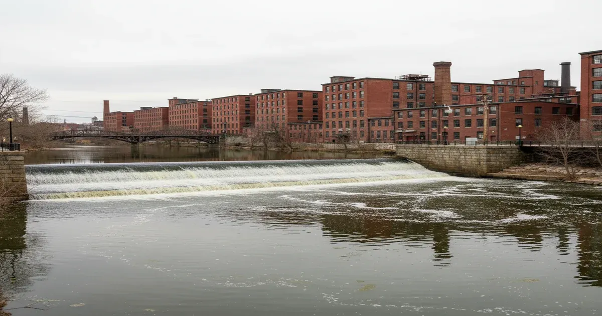 Lawrence Massachusetts cityscape along the Merrimack River with historic mill buildings
