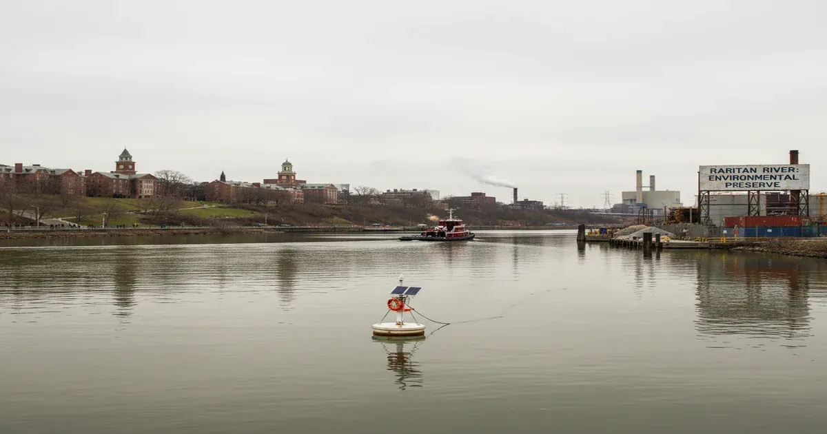 Raritan River flowing through New Brunswick New Jersey with city skyline