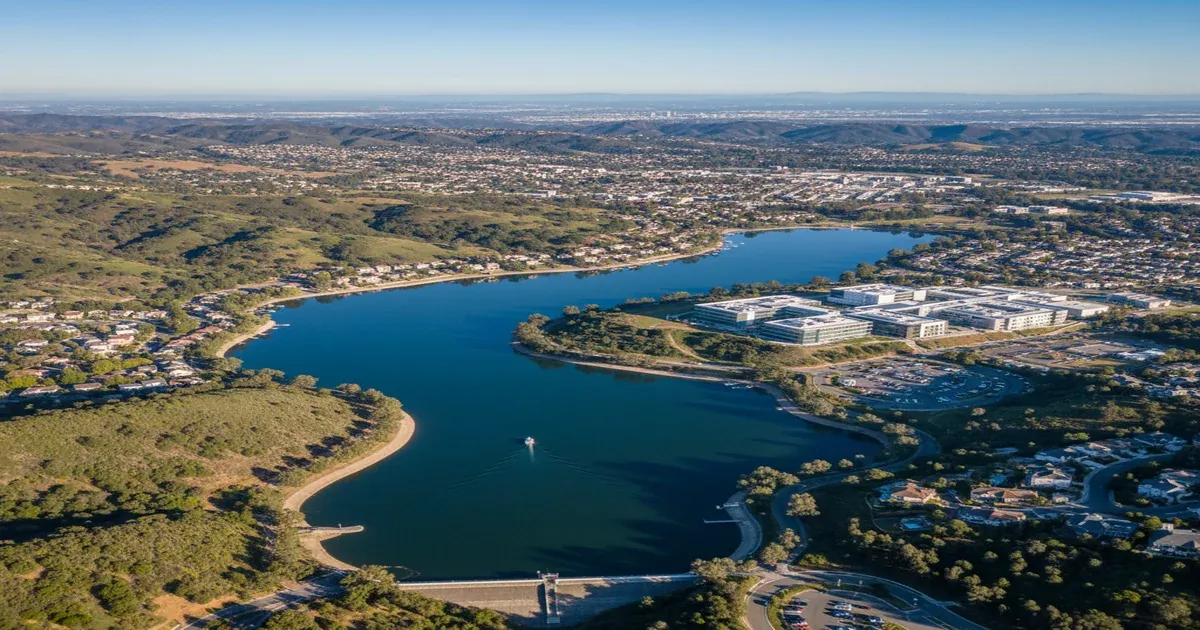 Aerial view of San Jose California with surrounding hills and reservoir